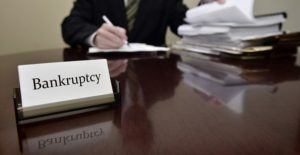 a bankruptcy lawyer goes over paperwork