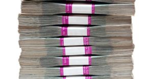a stack of counted and divided bills