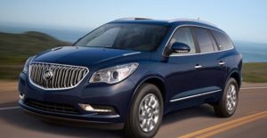 a 2017 navy buick enclave driving down the road