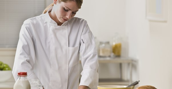 a chef works in a kitchen after completing culinary school