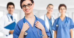a group of nurses look toward the camera