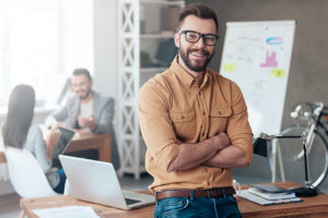 a man in an office is excited to take some business leadership development training