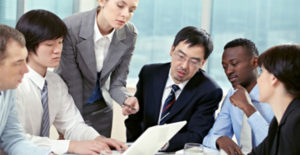 a group of mba graduates in a meeting