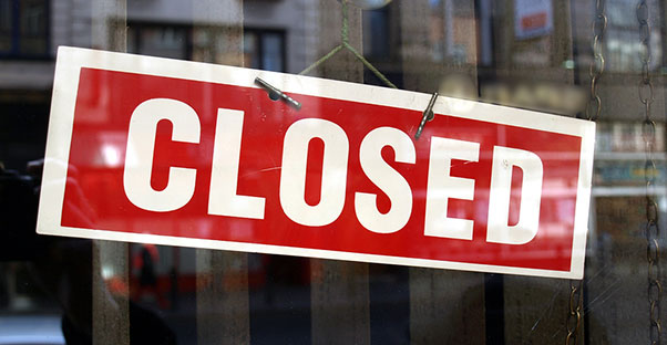 a closed sign symbolizing a business bankruptcy